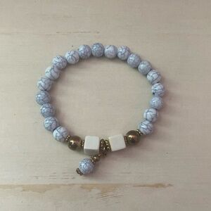 marble with gold bracelet